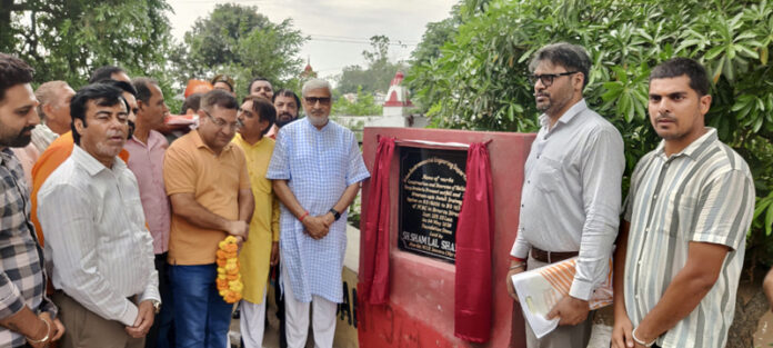 MLA Jammu North, Sham Lal Sharma laying foundation stone of drainage project in Patoli Brahmana on Monday.