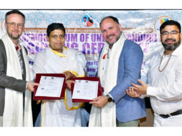 Dignitaries from Patanjali Research Foundation and Southern Cross University of Australia posing for a photograph after inking MoU.