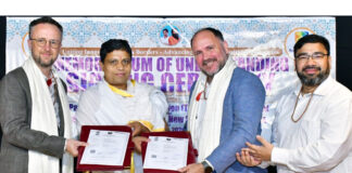 Dignitaries from Patanjali Research Foundation and Southern Cross University of Australia posing for a photograph after inking MoU.