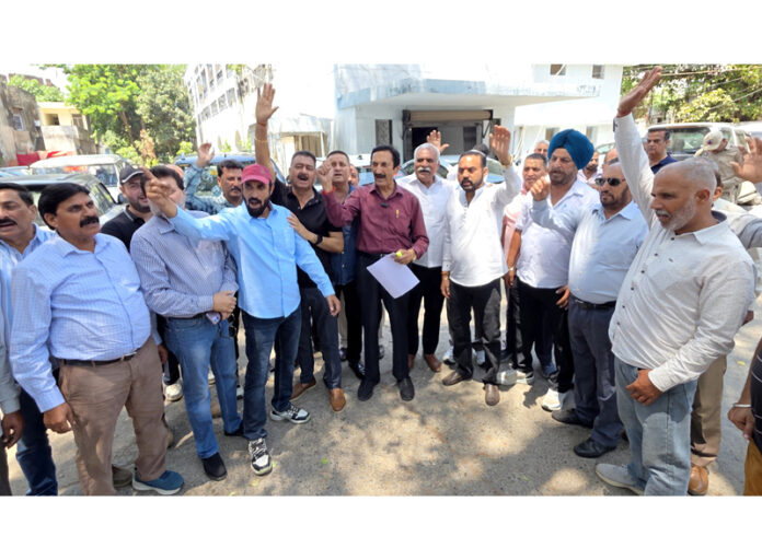 Members of the Contractors Association raising slogans during a protest demonstration in Jammu on Saturday.