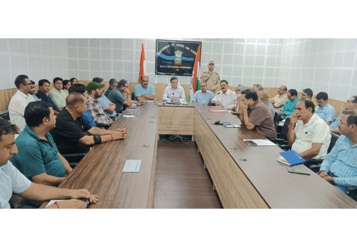 Members of Mata Kheer Bhawani Ji Yatra Welfare Society during a review meeting for the upcoming yatra.