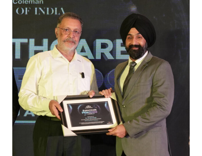 Dr Ranjit Singh receiving award from Punjab Health Minister Balbir Singh at an event in Ludhiana.