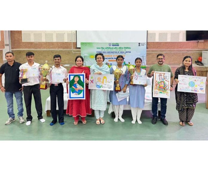 Painting competition winners under Swachhata Pakhwada organized by POWERGRID posing with their creations and awards in Jammu on Saturday. Painting competition winners under Swachhata Pakhwada organized by POWERGRID posing with their creations and awards in Jammu on Saturday.