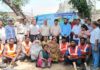 JMC team posing for a group photograph after a special sanitation drive at Deeli area on Saturday.