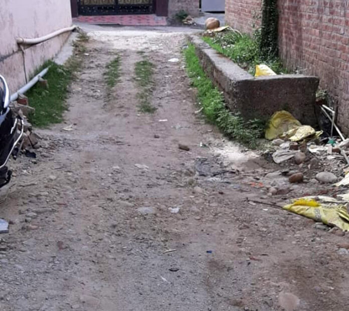 Dilapidated condition of a lane in Laxmipuram area of Bantalab, Jammu.