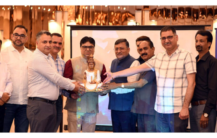 Dr Vikas Padha posing with other doctors to celebrate his unique century of joint replacements in Rajouri district.