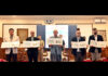 LG Manoj Sinha, along with dignitaries, posing with the Special Cover (postal envelope) released to commemorate J&K’s Ranji Trophy victory during a programme at Lok Bhawan.
