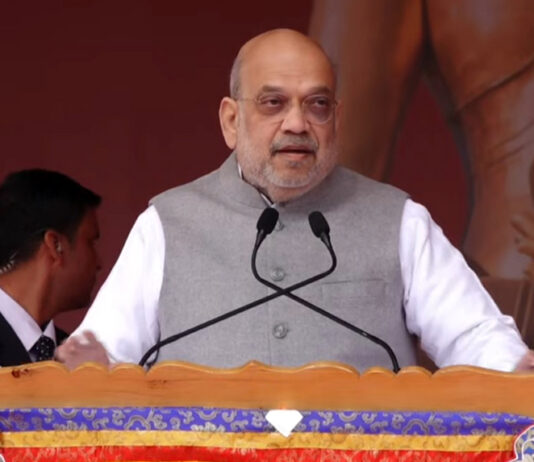 Union Home Minister Amit Shah addresses religious gathering in Leh on Friday.