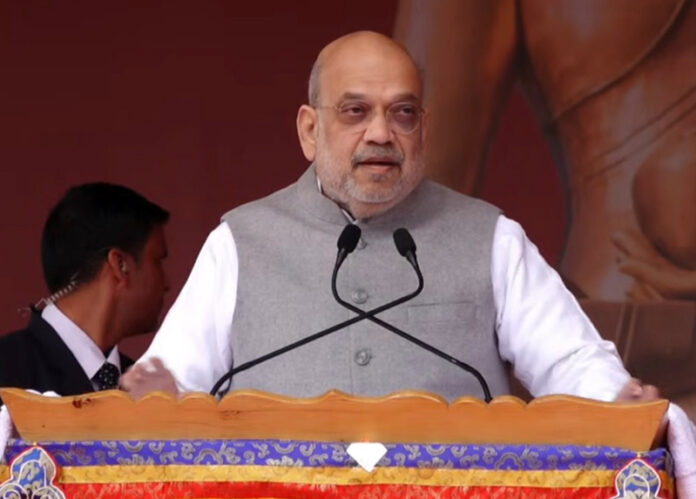 Union Home Minister Amit Shah addresses religious gathering in Leh on Friday.