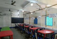 Counting arrangements at Mekhliganj Higher Secondary School in Coochbehar district in West Bengal on Sunday. (UNI)