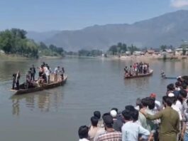 Rescue teams trying to locate bodies of drowned youth.