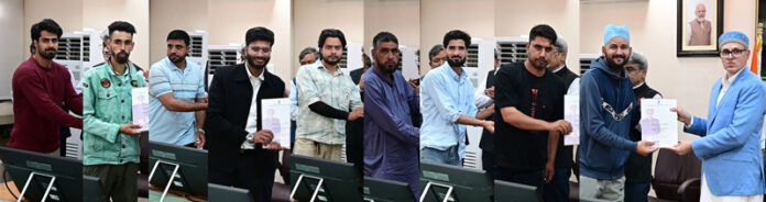 CM Omar Abdullah handing over compassionate appointment letters. CM Omar Abdullah handing over compassionate appointment letters.