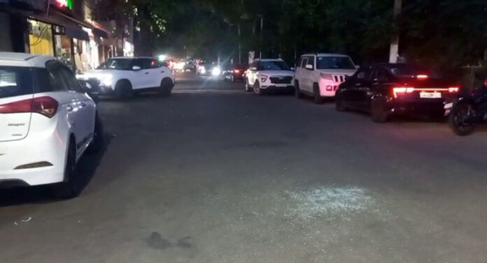 Shattered glass seen on the road after exchange of fire between police and suspected gangsters at Mini Market area, Gandhi Nagar in Jammu on Tuesday. Shattered glass seen on the road after exchange of fire between police and suspected gangsters at Mini Market area, Gandhi Nagar in Jammu on Tuesday.