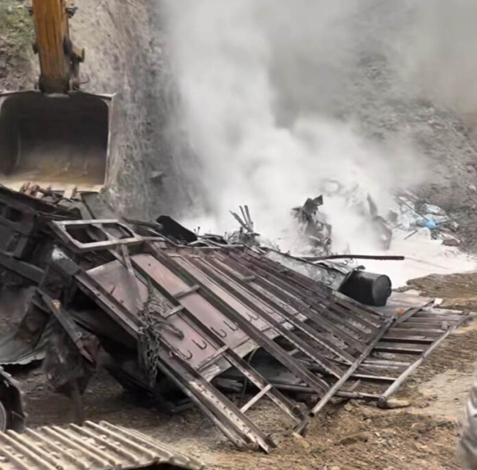 Mingled remains of a truck which fell into a gorge and got burnt in Ramsoo area of Ramban on Saturday. — Excelsior/Parvez Mir
