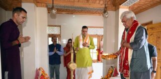 LG Manoj Sinha offers prayers at the temple on Monday.