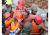 An injured labourer being rescued by NDRF, SDRF and local police personnel at Thathar area. — Excelsior/Rakesh