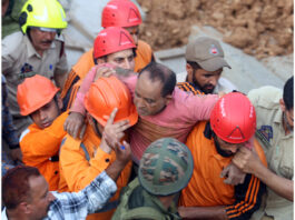 An injured labourer being rescued by NDRF, SDRF and local police personnel at Thathar area. — Excelsior/Rakesh