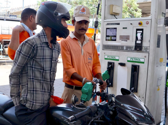 Commuters queue up at a petrol pump in Jammu on Monday. Commuters queue up at a petrol pump in Jammu on Monday.