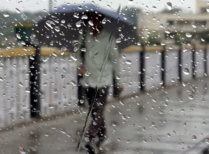 A man walks with umbrella cover during rain in Jammu on Saturday. Another pic on page 4. — Excelsior/Rakesh A man walks with umbrella cover during rain in Jammu on Saturday. Another pic on page 4. — Excelsior/Rakesh
