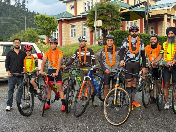 Cyclists posing for a group photograph after completing their journey in Bhaderwah. -Excelsior/Tilak Raj