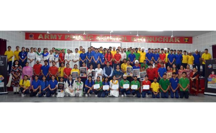 Students posing along with dignitaries during a programme. Students posing along with dignitaries during a programme.