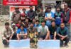Winning team posing along with dignitaries. -Excelsior/Basharat Ladakhi