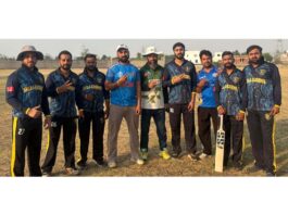 Winning team posing for a group photograph.