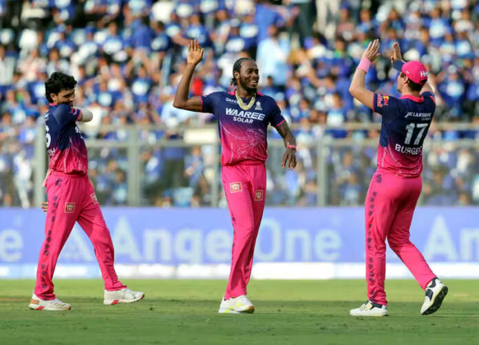 Rajasthan Royals players celebrating after defeating Mumbai Indian by 30 run at Mumbai on Sunday. Jofra Archer celebrating with teammates after taking a wicket against Mumbai Indians in Mumbai.