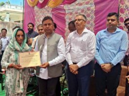 MLA, Kathua, Dr Bharat Bhushan handing over sanction letter of relief to a flood hit victim in Kathua on Wednesday.