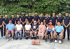 J&K Junior Basketball team posing along with dignitaries during a programme.