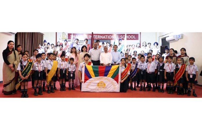 Students of Shaurya International School posing with guests and management.