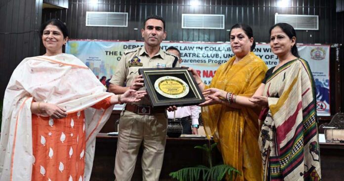 Chief guest being presented memento during awareness programme at JU. Chief guest being presented memento during awareness programme at JU.