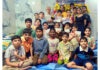 Winners of different rounds of "Amrita Cup" Chess Championship posing together for a group photograph.