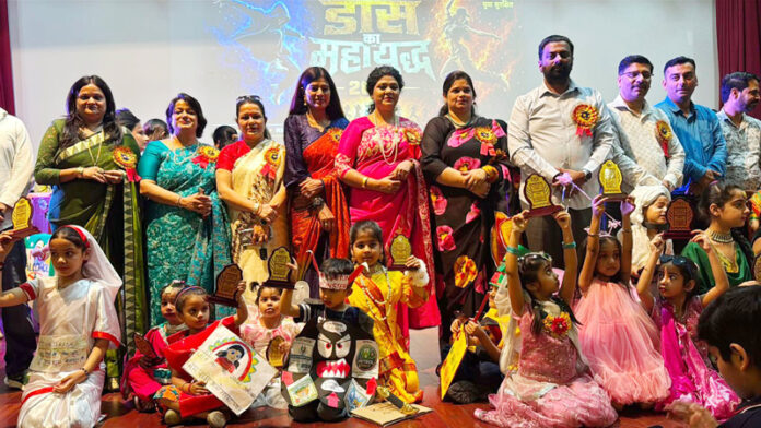 Dignitaries posing along with students during a programme.