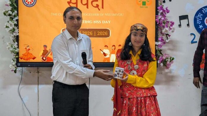 Dignitaries presenting memento to a student.