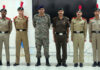 Officer and NCC cadets posing for a group photograph during the rank conferring ceremony at SMVDU.