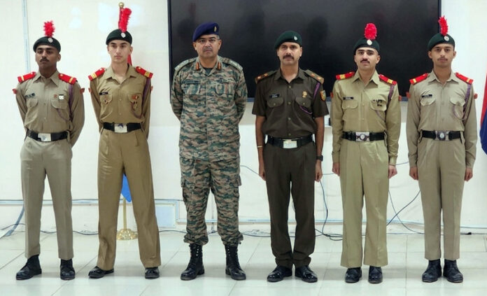 Officer and NCC cadets posing for a group photograph during the rank conferring ceremony at SMVDU.