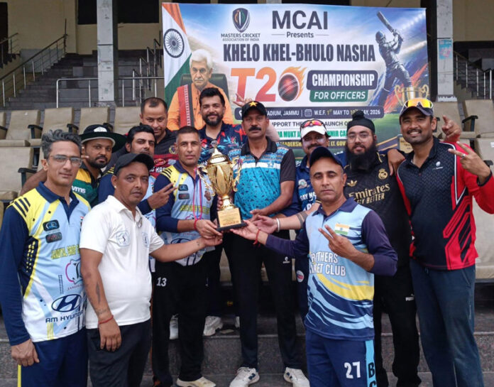 Dignitary presenting trophy to the winning team during a programme. Dignitary presenting trophy to the winning team during a programme.