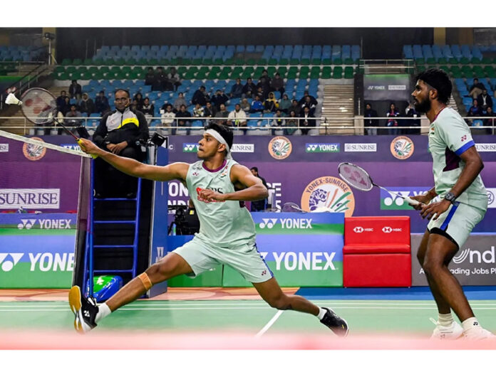 Satwiksairaj Rankireddy and Chirag Shetty in action during a Thomas Cup match.