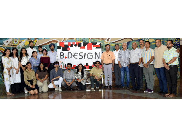 Dignitaries posing along with students during a programme.