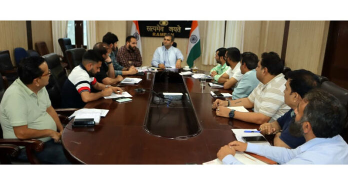 DC Ramban chairing a meeting.