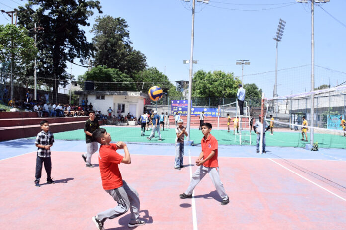 Players in action during Inter-Zonal U-17 Volleyball competition at Khel Gaon, Nagrota.