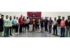 Winners posing along with dignitaries during a programme.