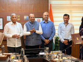 LG Ladakh with officers displaying copy of MoU signed with Union Ministry of Jal Shakti.