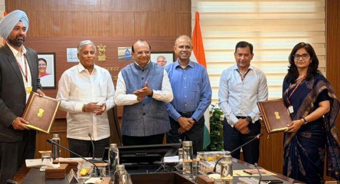 LG Ladakh with officers displaying copy of MoU signed with Union Ministry of Jal Shakti.