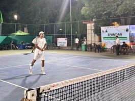 Tennis player in action during a match.