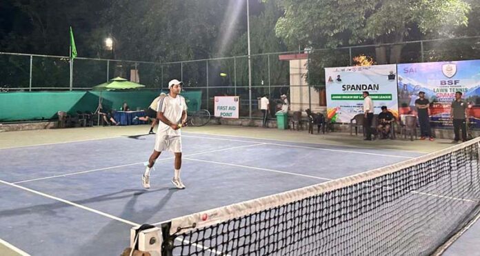 Tennis player in action during a match. Tennis player in action during a match.