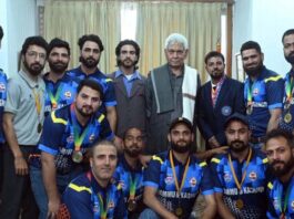 A delegation of Deaf Cricket Association J&K posing for a group photograph with LG Manoj Sinha.