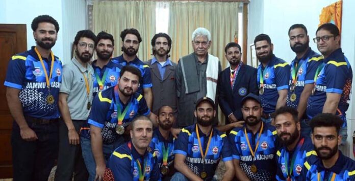 A delegation of Deaf Cricket Association J&K posing for a group photograph with LG Manoj Sinha. A delegation of Deaf Cricket Association J&K posing for a group photograph with LG Manoj Sinha.