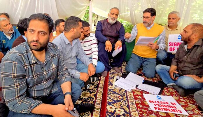 Salman Sagar meeting protesting JJM contractors in Srinagar on Thursday. -Excelsior/Shakeel